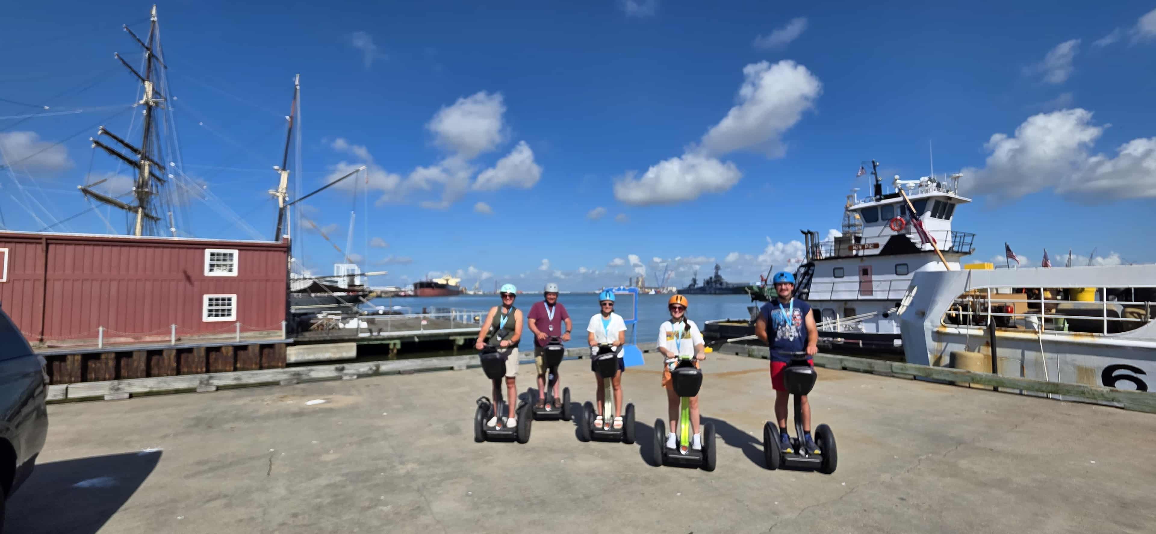 Tourists exploring Galveston on Segways